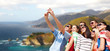© Syda Productions - travel and tourism concept - group of happy friends taking selfie by cell phone over big sur coast of california background