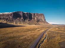 Empty Road Through Wide Open Space In Iceland