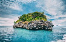 Wonderful Scene The Limestone Rock Covered With The Vegetation In The Ocean Next To The Exotic Phi Phi Islands, The Kingdom Of Thailand. Beauty Of Wild Tropical Nature.