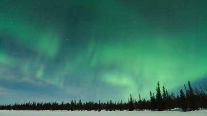 time lapse of aurora borealis (northern lights) over lake pallasjärvi in pallas-yllästunturi nationa