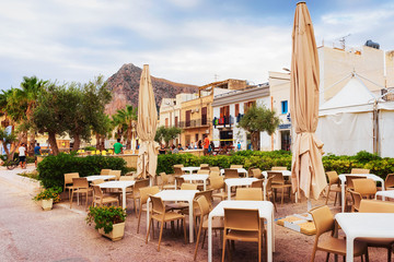 Poster - People at sidewalk cafe San Vito lo Capo Sicily