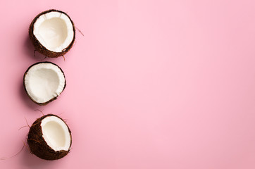 Wall Mural - pattern with ripe coconuts on pink background. top view. copy space. pop art design, creative summer