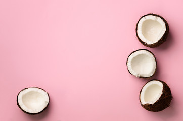 Wall Mural - pattern with ripe coconuts on pink background. top view. copy space. pop art design, creative summer