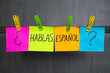 Colorful notes with question Do you speak Spanish on the dark background.