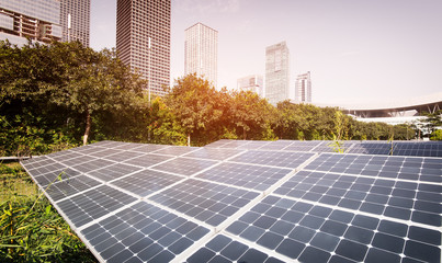 Wall Mural - solar panel plant with urban landscape landmarks,ecological energy renewable concept.