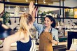 © Rawpixel.com - Women give a high five to each other