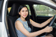 © aot - Cute young lady happy driving car
