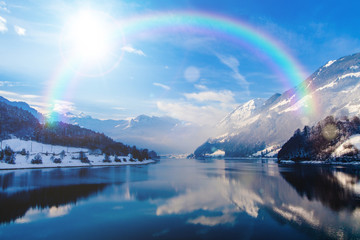 Wall Mural - beautiful landscape in winter with rainbow