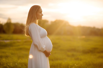 pregnant at sunset