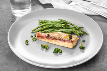 Sticker - Plate with tasty fish and green beans on table