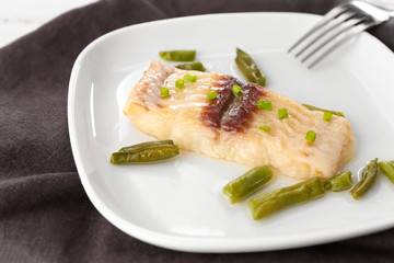 Sticker - Plate with tasty fish and green beans on table