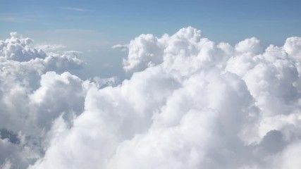 beautiful cloudy sky. fluffy сumulus clouds illuminated by sunlight passing by camera. gorgeous skys