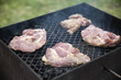 © benna23 - Raw steaks grilling on BBQ