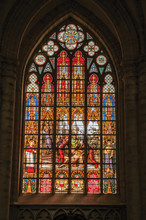 Colorful Stained Glass Window In The St. Michael And St. Gudula Cathedral At Brussels. It Is The Country’s Capital And Administrative Center Of The EU. Central Belgium