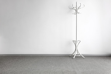 Wall Mural - bright home interior with white coat rack on gray floor and copy space for your decoration or produc