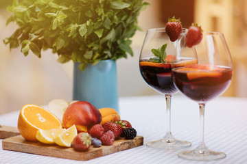 Wall Mural - Top view of summer dinks, fruit cocktails on white wood table wi