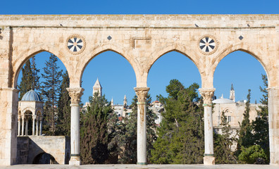 Wall Mural - JERUSALEM, ISRAEL - MARCH 5, 2015: The look cross the west gate from the Temple Mount to in morning light with the towers of Redeemer church and Latin patriarchate.