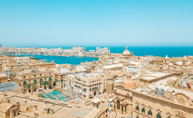 Wall Mural - Valletta, Malta panorama - The traditional houses and walls of Valletta, the capital city of Malta on an early summer morning before sunrise with clear blue sky