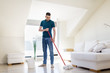 © Syda Productions - household, housework and people concept - man with mop and bucket cleaning floor at home
