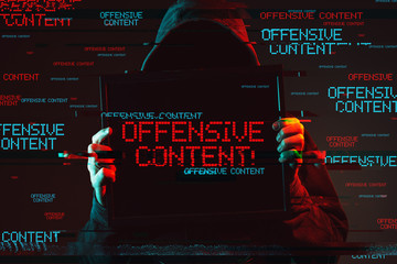Wall Mural - Offensive content concept with faceless hooded male person