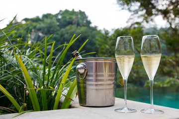 Wall Mural - glasses of champagne near pool