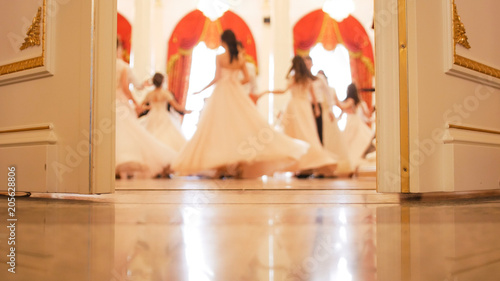 Fotografía Ladies with cavaliers in vintage costumes dancing waltz