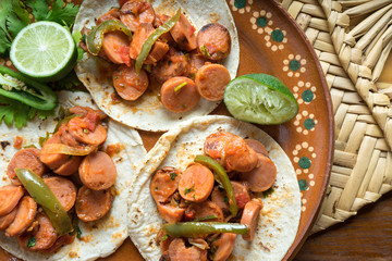 Mexican tacos of sausage stew