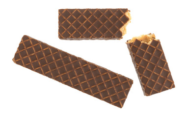 Wall Mural - Broken chocolate covered peanut butter wafer cookies top view isolated on a white background.