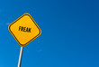 freak - yellow sign with blue sky