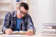 © Elnur - Young student preparing to school exams with books