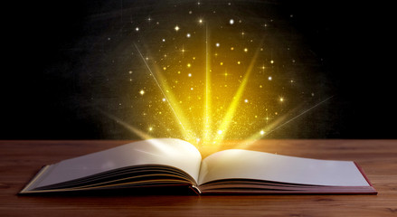 Sticker - Yellow lights and sparkles coming from an open book 