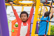 © weedezign - two kids boy having fun to play on children's climbing toy at school playground,back to school activity.kindergarten preschool.