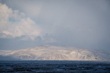 Dramatic icelandic landscape with snow covered mountains. Cold winter day in Iceland.