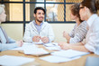 © pressmaster - Happy young businessman listening to ideas and opinions of his colleagues at working meeting