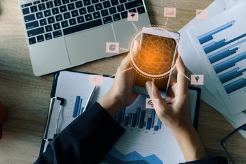 Innovations connection icons. Financial business using mobile phone and laptop with finance graph at office desk. business technology concept.