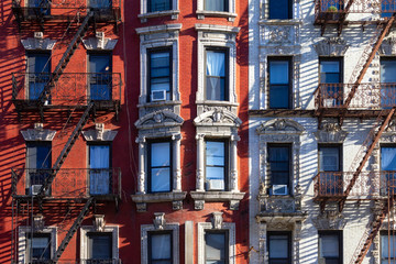 Fototapete - New York City style architecture background with windows and fire escapes