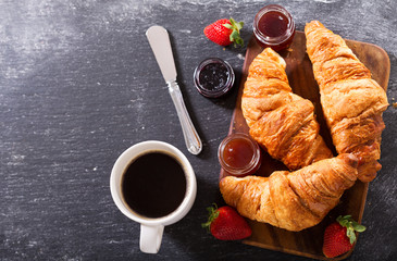 Wall Mural - breakfast with croissants and coffee, top view