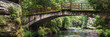 Panoramic view on old bridge in the forest at the rocks
