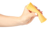 Fototapeta Tęcza - A slice of cheese in a hand on a white background isolation