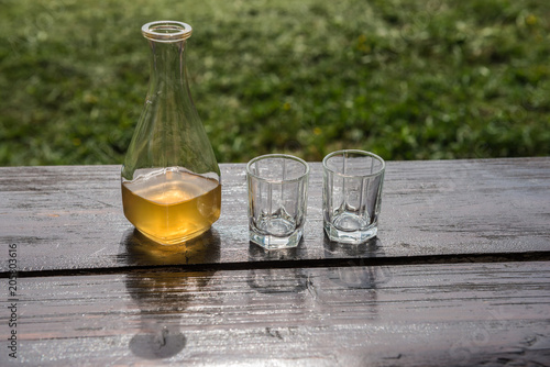 Sweet yellow honey wine meade on the wooden table Poster