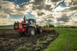 Tractor plowing fields.