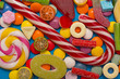 Multicolored candy and lollipops on a white background.