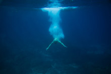 Partial View Of Man Diving Into Ocean
