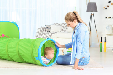 Canvas Print - Baby and mother playing with tunnel at home