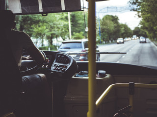 male bus driver in the paris city back view