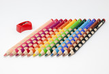 Fototapeta Tęcza - Colored pencils with sharpener
