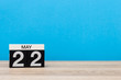 May 22nd. Day 22 of may month, calendar on blue background. Spring time, empty space for text