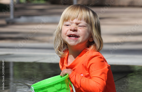Very Cute Toddler 2 Years Old Girl In Hot Orange Swimming Shirt
