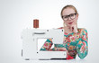 © afxhome - Young girl with glasses sews on a sewing machine