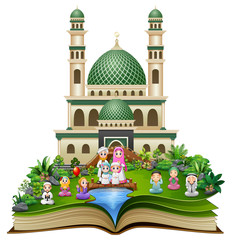 Wall Mural - Open book with Happy Muslim Family in front of a mosque